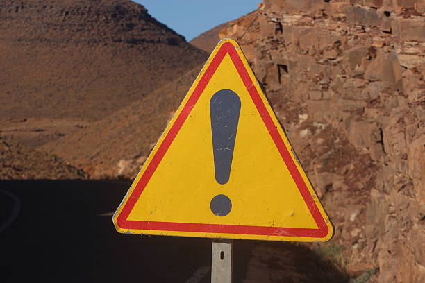 Triangular yellow and red danger sign