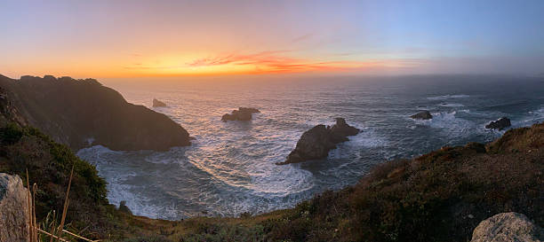 istock Panorama of Rocky Coastline at Sunset 2248287920