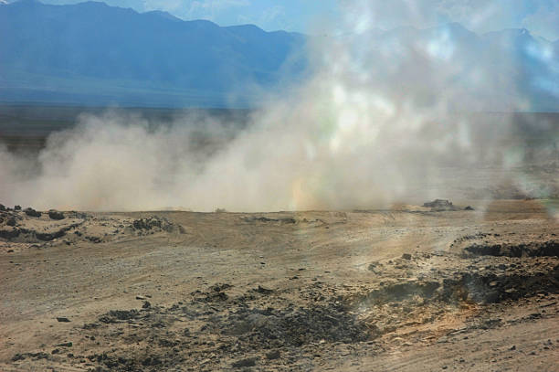 istock Dusty landscape with mountains in the background under a clear sky 2248289079