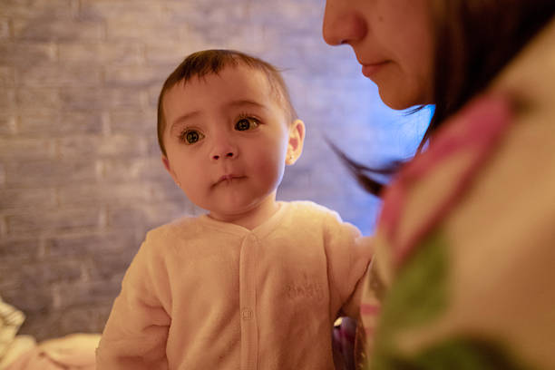 baby in her pajama overalls, ready for bed