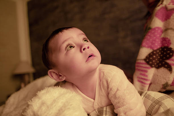 baby in her pajama overalls, ready for bed