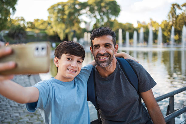 istock Father and son taking a selfie together in a scenic outdoor setting 2248290739