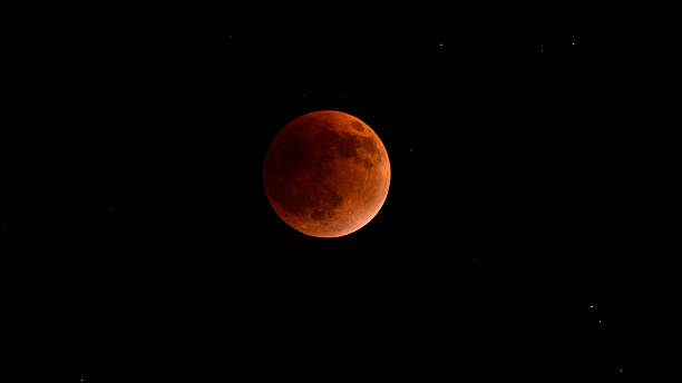 istock Blood moon during a lunar eclipse in the night sky. The moon appears red as it is shadowed by the Earth 2248291217