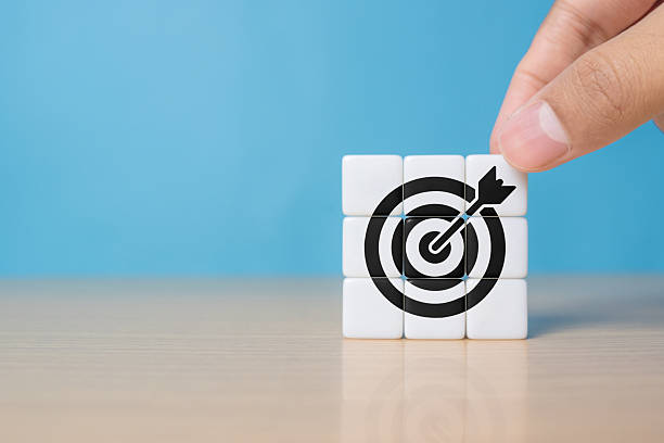 istock Goal and planning concept, Hand holding dice with target aiming dart board, Business achievement objective goal and project progress growth value processing marketing financial, Reach target 2248295710