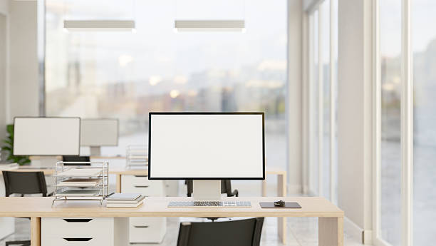 istock Blank screen computer and document on wooden drawer table and chair in office company workplace room 2248296369