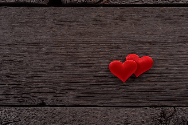 istock Two Red Hearts on Wooden Surface Symbolizing Love and Romance 2248299019