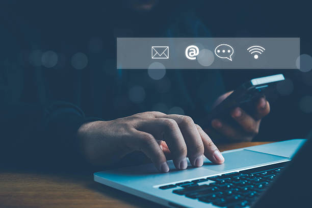 istock Concept of contact us, customer support, service, icon, Contact us or Customer support hotline people connect. Businessman using a laptop with the (email, call phone, mail) icons. customer service. 2248300770