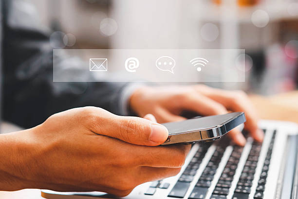 istock Concept of contact us, customer support, service, icon, Contact us or Customer support hotline people connect. Businessman using a laptop with the (email, call phone, mail) icons. customer service. 2248300821