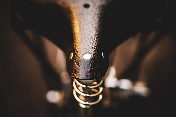 A beautiful, vintage leather seat detail with spring