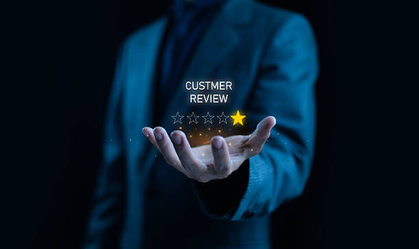 istock Businessman holding a digital one-star customer review rating symbolizing negative feedback, poor service experience, and brand reputation issues, ideal for marketing, business analysis, and customer. 2248302171