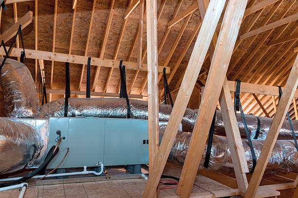 istock Insulation ductwork installation in an attic during home renovation project 2248303184
