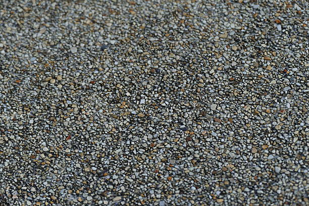 Materials for asphalt hot mix plant - heap of stones, clear blue sky, copy space. The photo is taken in asphalt factory near Sofia, Bulgaria with Sony A7III camera.