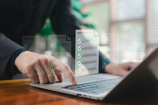 istock A business professional managing multiple digital checklist documents on a laptop with floating task panels, symbolizing workflow organization, approval processes, productivity, modern documentation 2248303922