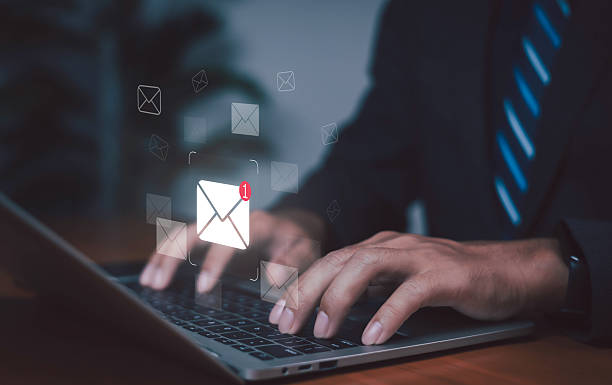 istock Businessman typing on laptop with digital email notification icon, representing communication, messaging, inbox alert, technology, and modern business connection. 2248304244