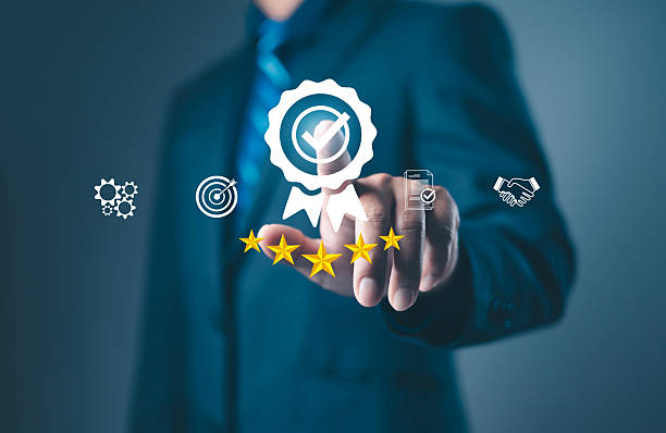 istock Businessman touching digital five star quality assurance icon, symbolizing customer satisfaction, service excellence, trust, and professional success in modern business management. 2248304339