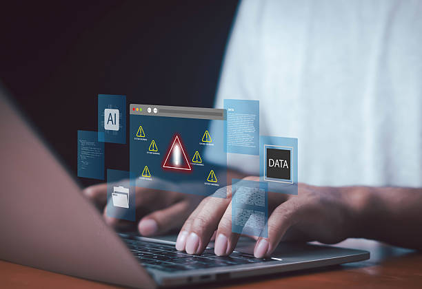istock Cybersecurity warning concept with AI and data protection alert on laptop screen, showing system error, digital risk, and online security threat in futuristic interface. 2248304404