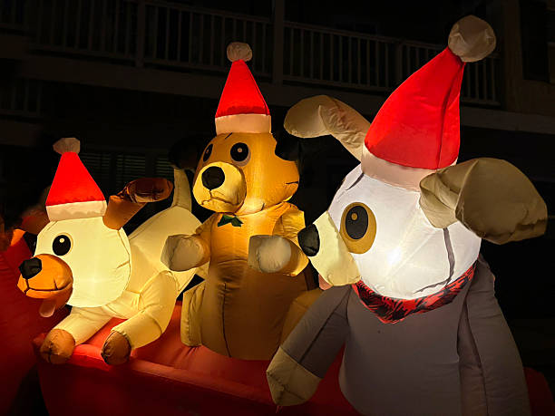 Merry X-mas! Inflatable toys dogs animals cheerfully greet everyone who sees them. Holiday season, time for celebration and decoration