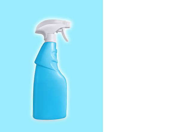 Isolated blue spray bottle on white and blue background. There is space for text.