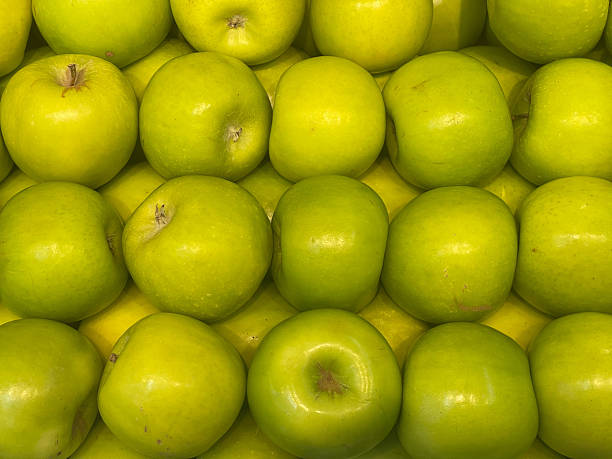 Green apples on grocery tray