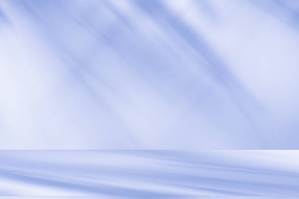 istock Studio style background wall decoration presentation uses white and blue tones. with shadows cast from a nearby window, concept creating a decorative 2248307853