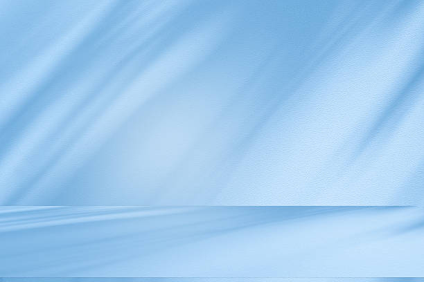 istock Studio style background wall decoration presentation uses white and blue tones. with shadows cast from a nearby window, concept creating a decorative 2248307886