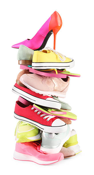 istock Stack of various female shoes isolated on white 2248309319