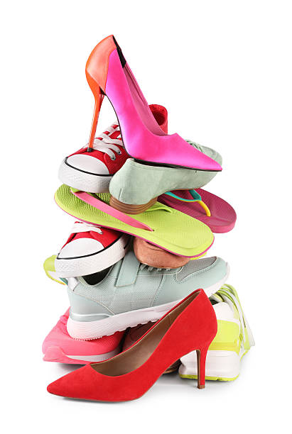 istock Stack of various female shoes isolated on white 2248309322