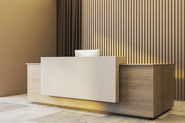 istock Modern empty reception desk in stylish office interior with wood panel wall and soft lighting, clean space perfect for branding mockup template. 3D Rendering 2248309463