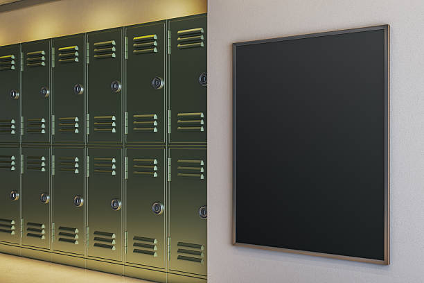 istock Blank vertical black frame mockup next to green school lockers in modern indoor hallway interior concept for signage or poster display design. 3D Rendering 2248309505