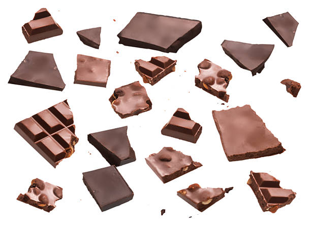 istock Assorted broken chocolate pieces with nuts isolated on white background for dessert, confectionery and sweet food concepts 2248311759