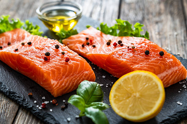 istock Fresh raw salmon steaks on stone cutting board 2248313934