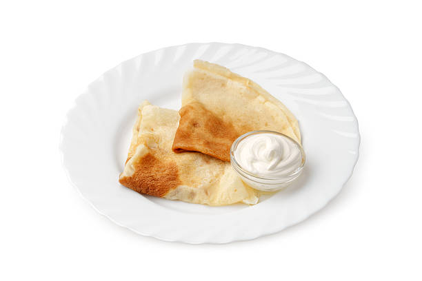 istock Delicious flatbread served with creamy dip on a white plate for snack time 2248315269