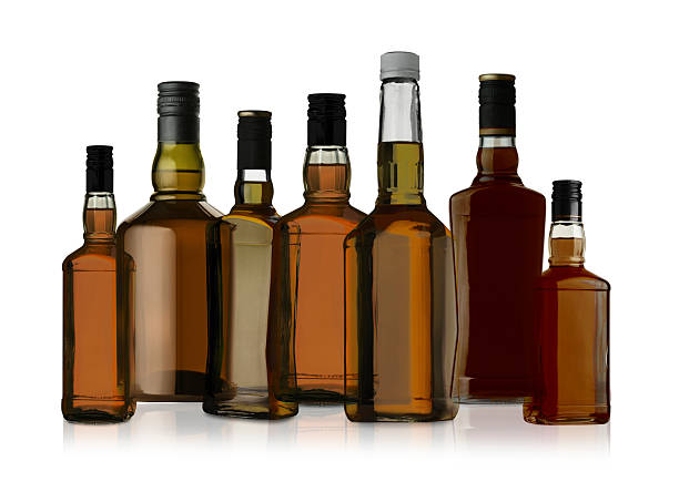 istock Many bottles of whiskey isolated on white, set 2248317015