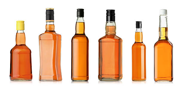 istock Many bottles of whiskey isolated on white, set 2248317026
