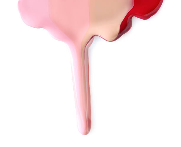 istock Mixed different color nail polishes flowing on white background 2248317707
