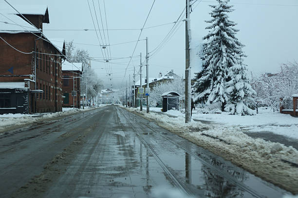 istock City, city streets covered in snow, first snow 2248318437
