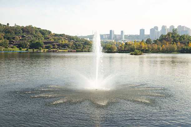 istock fountain in the park in autumn 2248319047