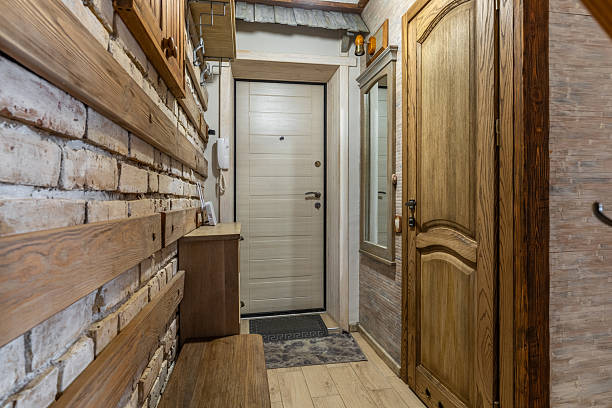 istock Rustic Hallway with Brick Wall and Wooden Doors Interior 2248319499