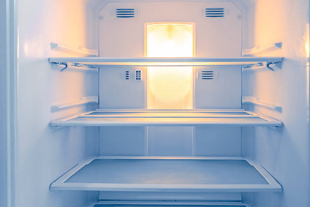istock View Inside an Empty Refrigerator with Clean Glass Shelves for Home Storage 2248320789