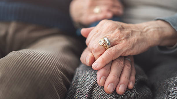 istock Elderly couple holding hands and supporting each other 2248320927
