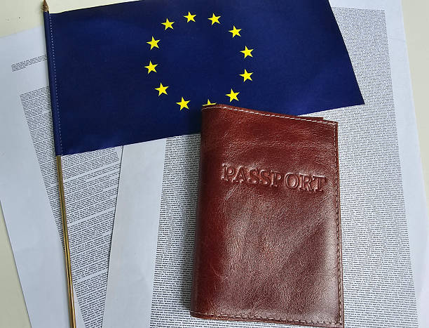 istock Passport resting on documents beside EU flag showcasing travel readiness and documentation importance concept 2248320955