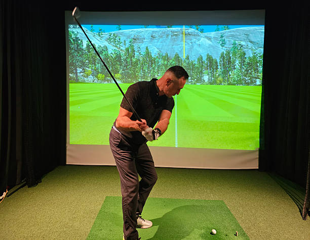 istock Indoor golf swing practice at a virtual driving range with a digital background scene concept 2248320992