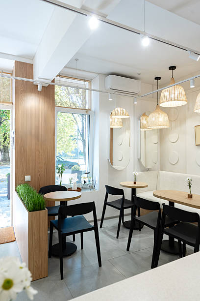 istock Cozy cafe interior with natural light and modern decor in urban setting 2248321153