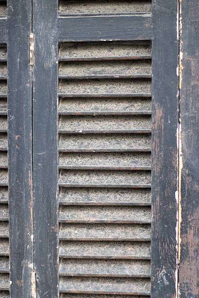 istock old traditional dark green weathered shutters in Mallorca 2248322116