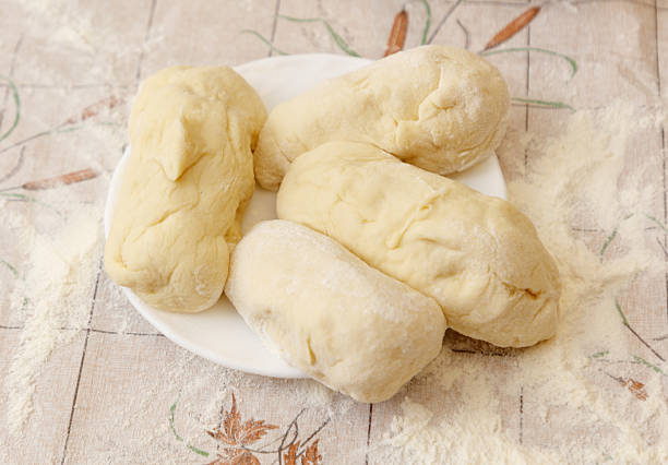 istock A plate of doughnuts with a white tablecloth underneath 2248326507