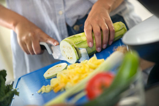 Young woman cooking lunch at home.