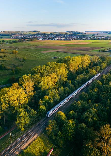 istock Train traveling through lush countryside. 2248329243