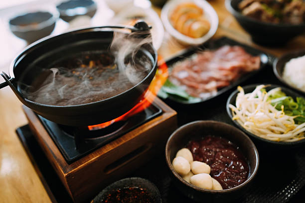 istock Thai-Japanese Fusion: Boat Noodle Nabe Hot Pot - Tabletop Cooking Scene 2248329522