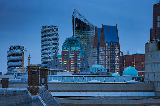 skyline with the modern office buildings in the centre of The Hague  at dusk; The Hague, Netherlands