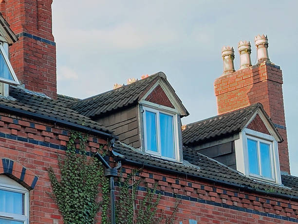 istock A typical English roof with dormers and chimneys 2248335974